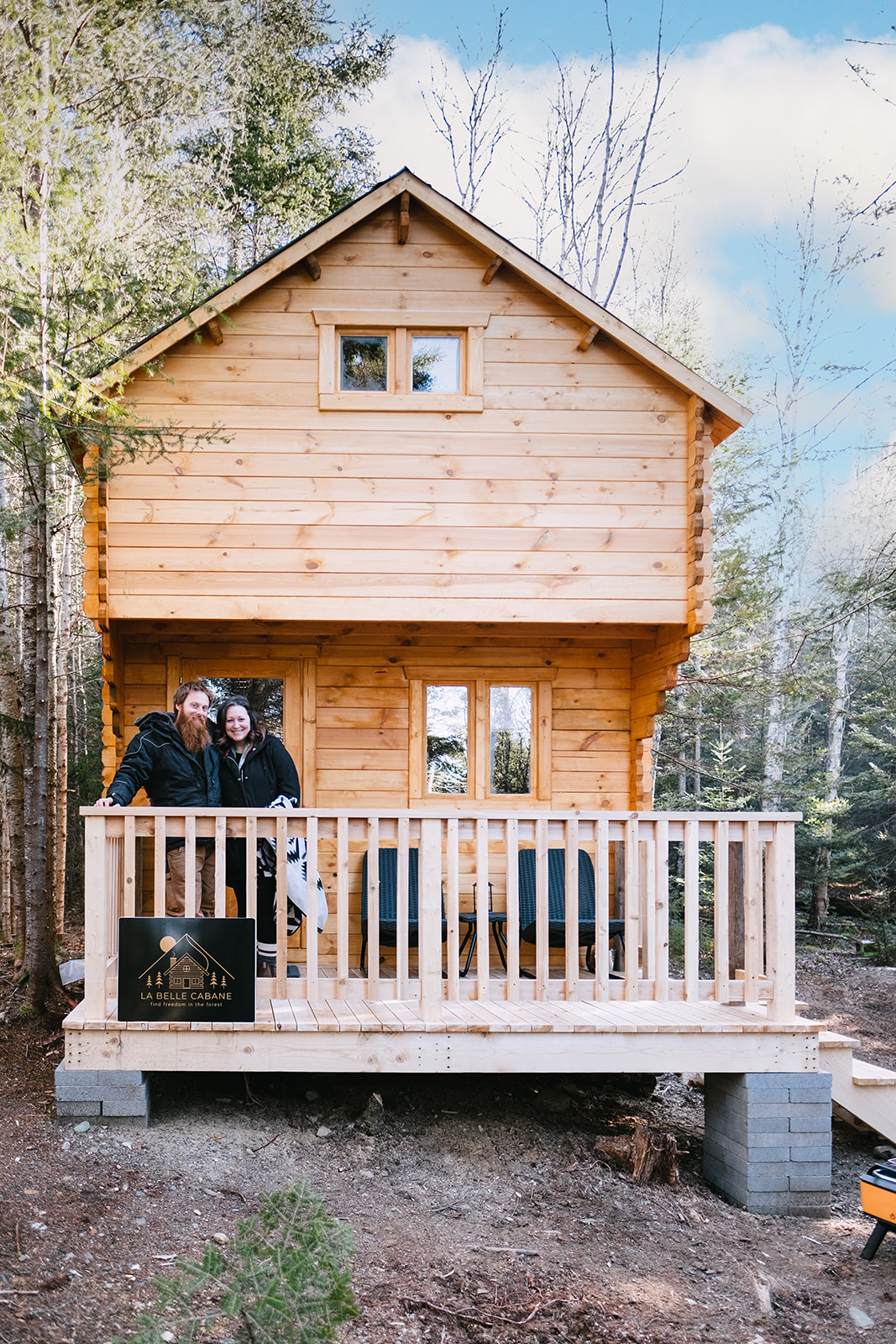 couple on porch of cabin