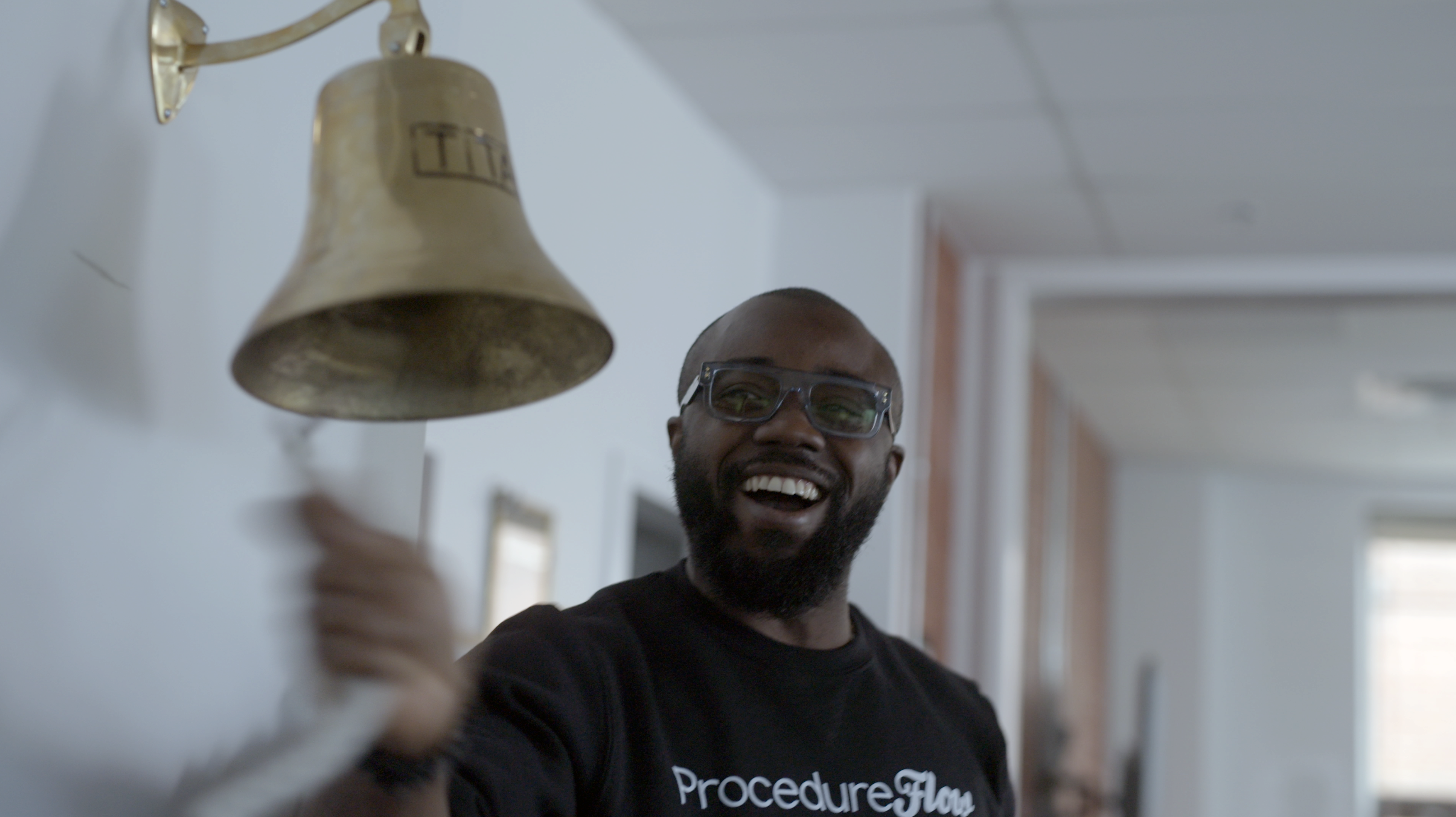 man ringing bell smiling
