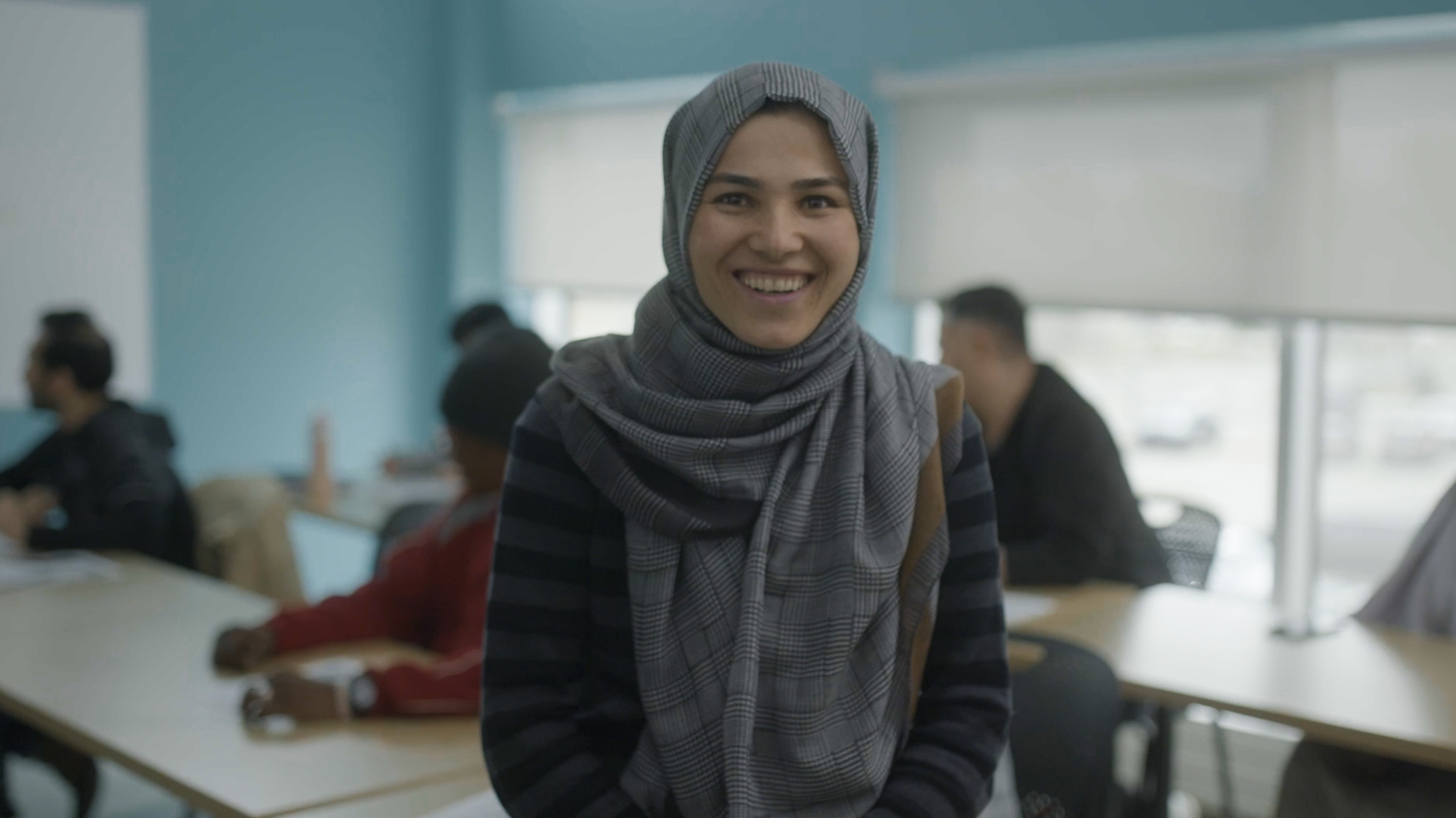 Woman in classroom smiling