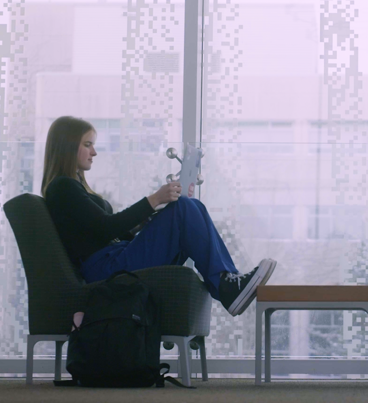 woman on chair reading