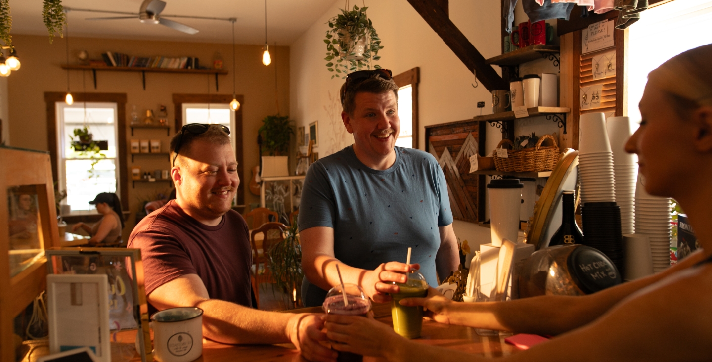 Customer at coffee shop smiling