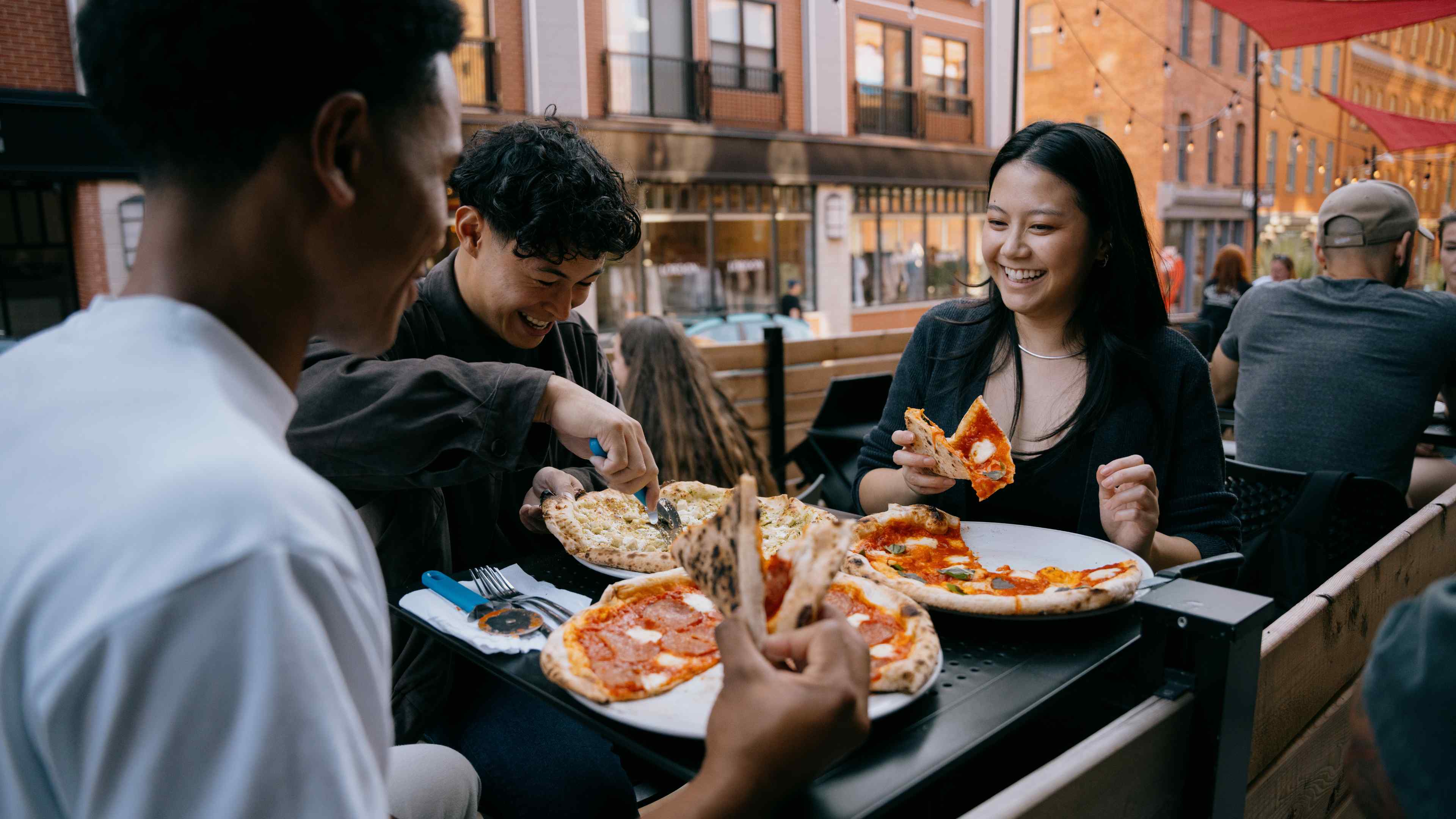 Group eating together uptown