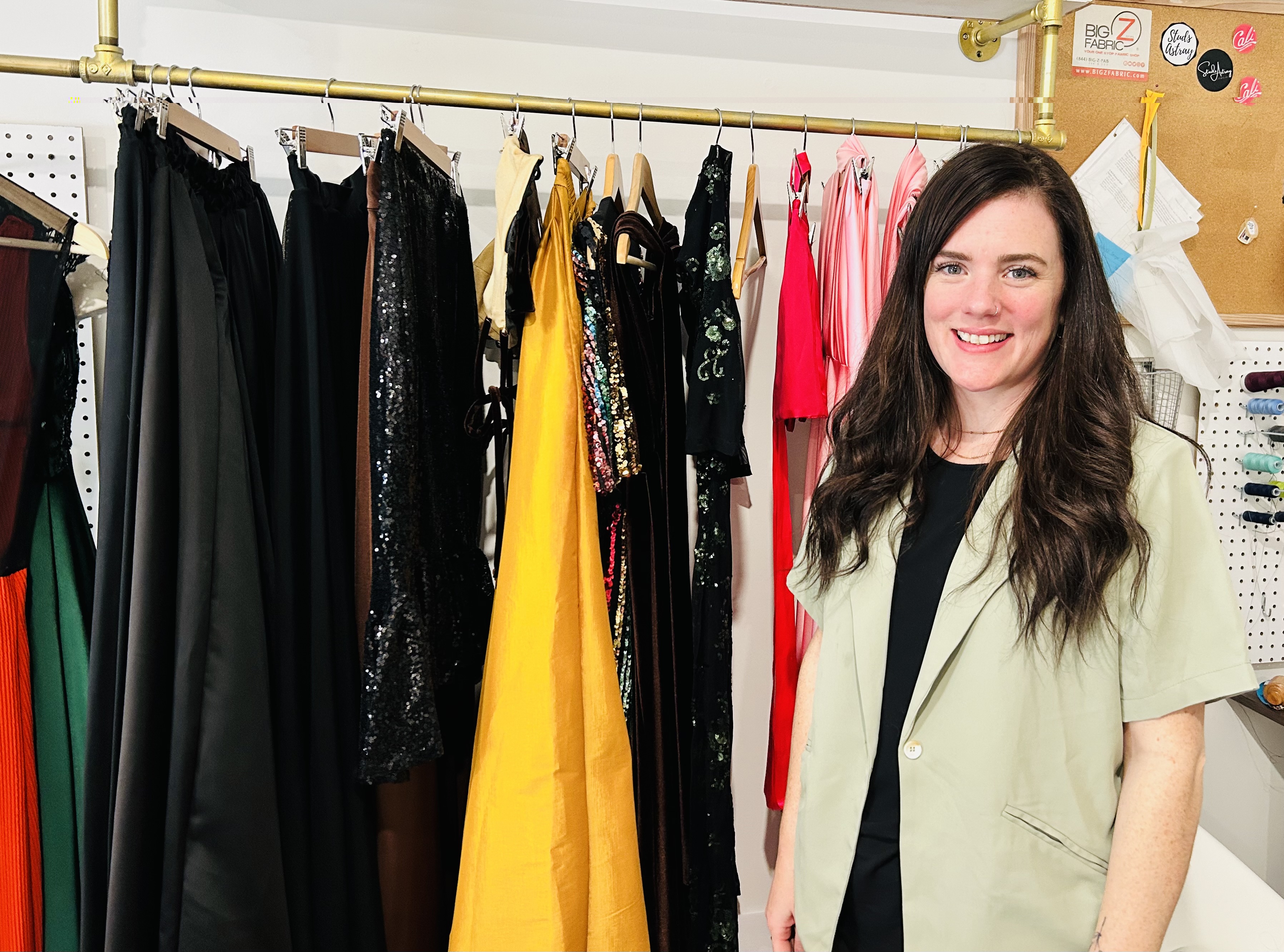 woman standing in front of clothing