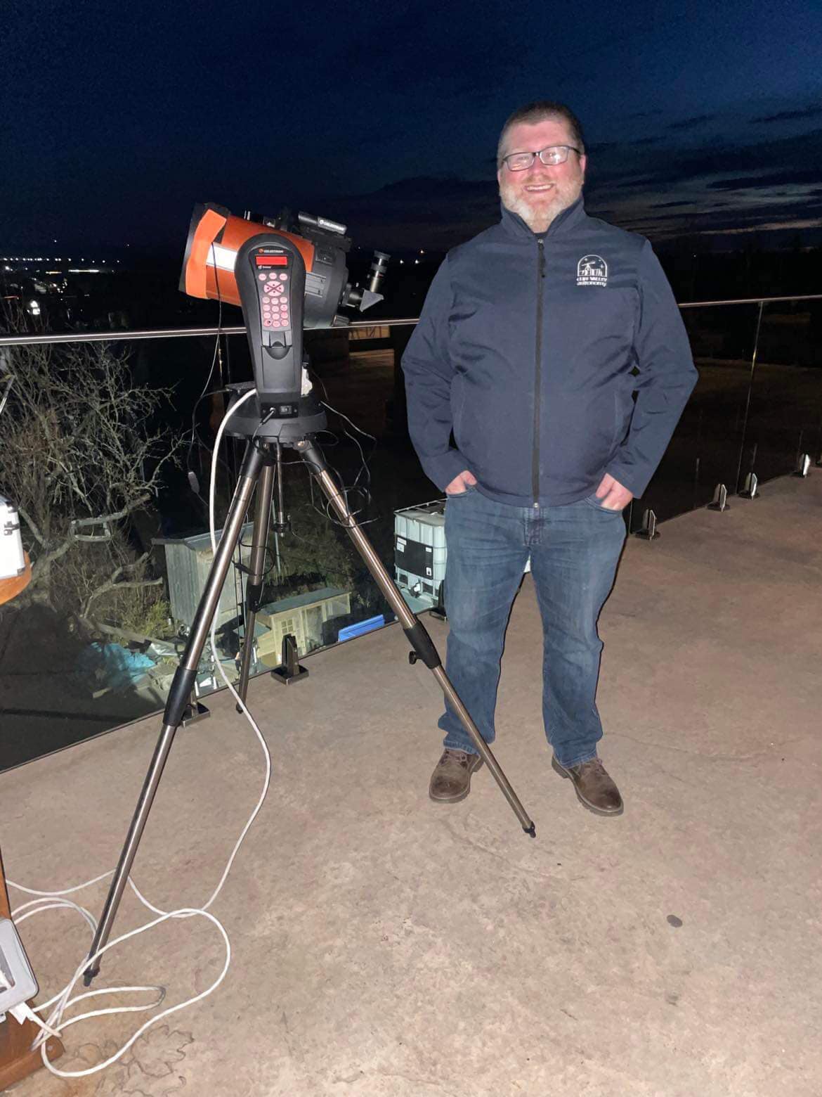 Man standing with telescope