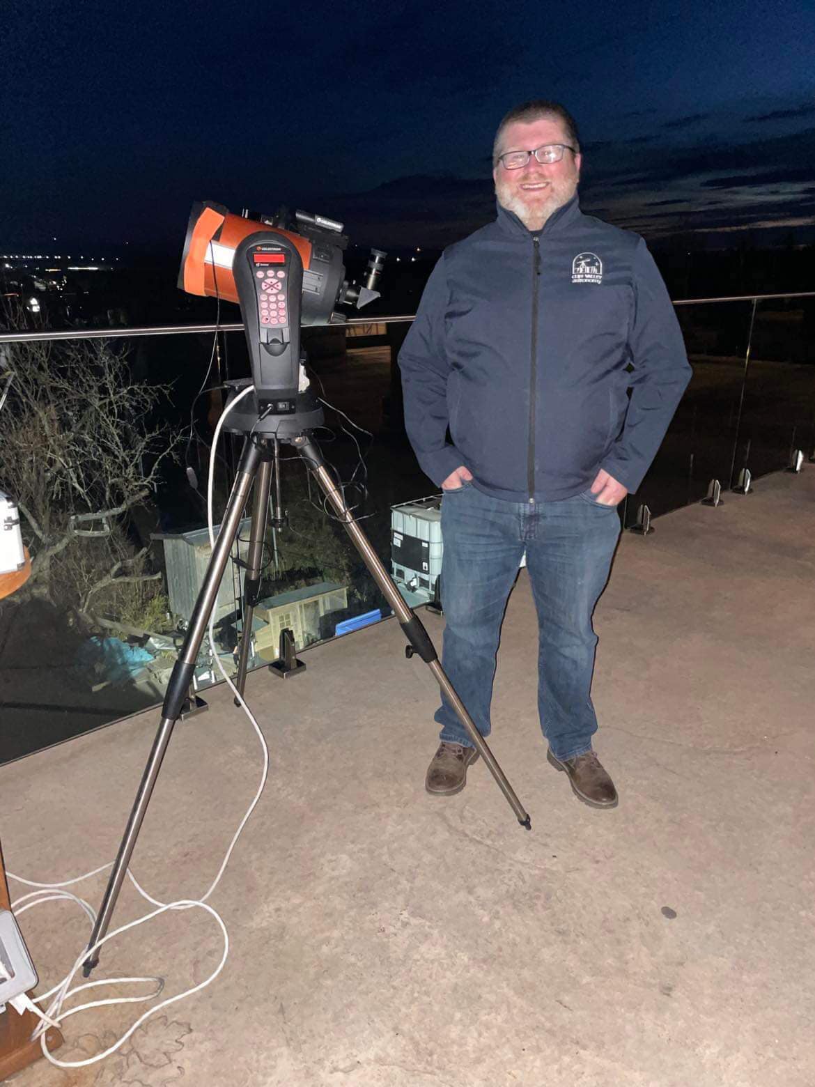 Man standing with telescope 