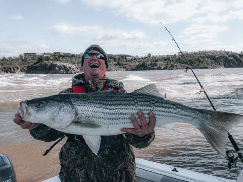 man smiling with big fish