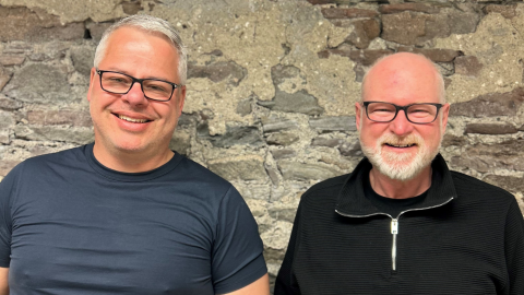two men smiling
