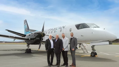 men standing in front of a plane 
