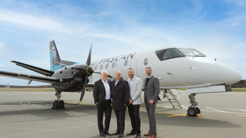 men standing in front of a plane 